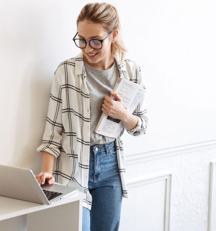 lovely-young-girl-student-studying-with-laptop-NNVUKN4